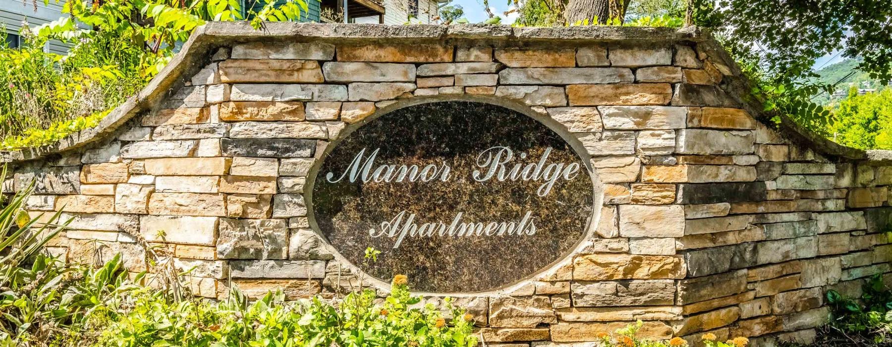 Manor Ridge Apartments property sign set in stone