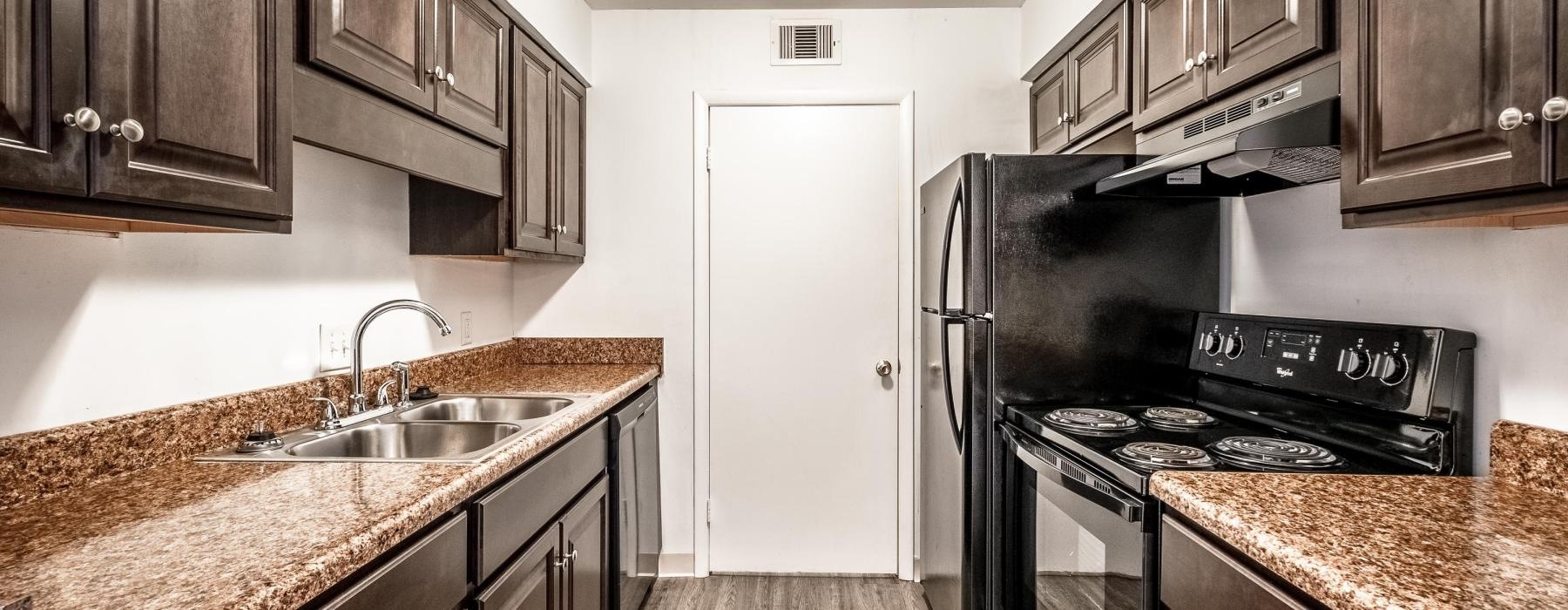 galley kitchen with lighting