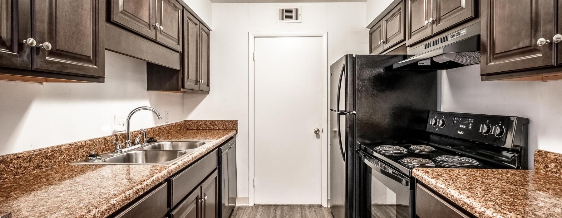 galley kitchen with lighting