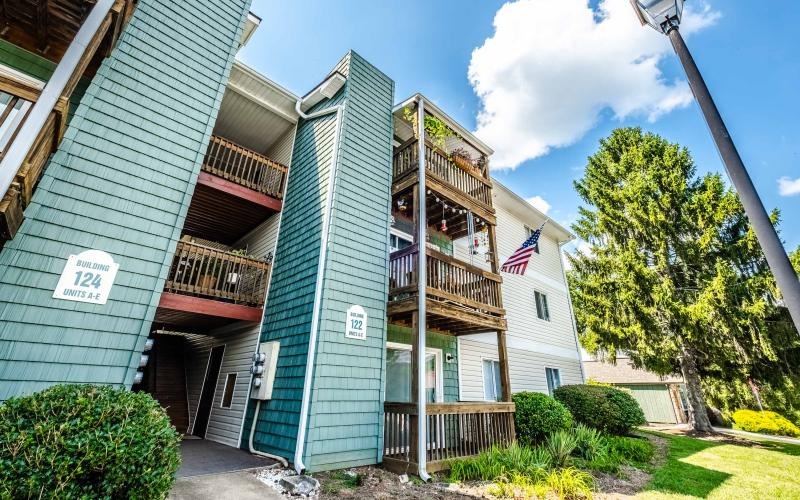 3-story apartment buildings with private patios and balconies